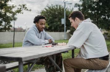 Two Players Playing Chess at the Park
