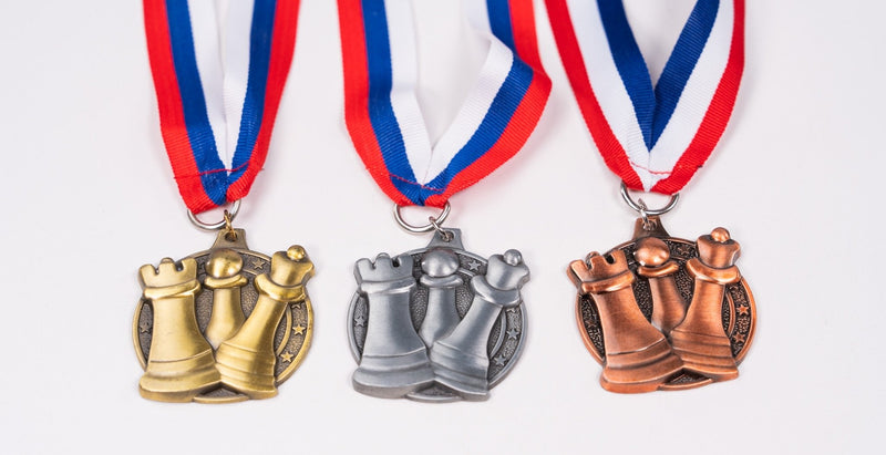 Round style chess medals for club awards.