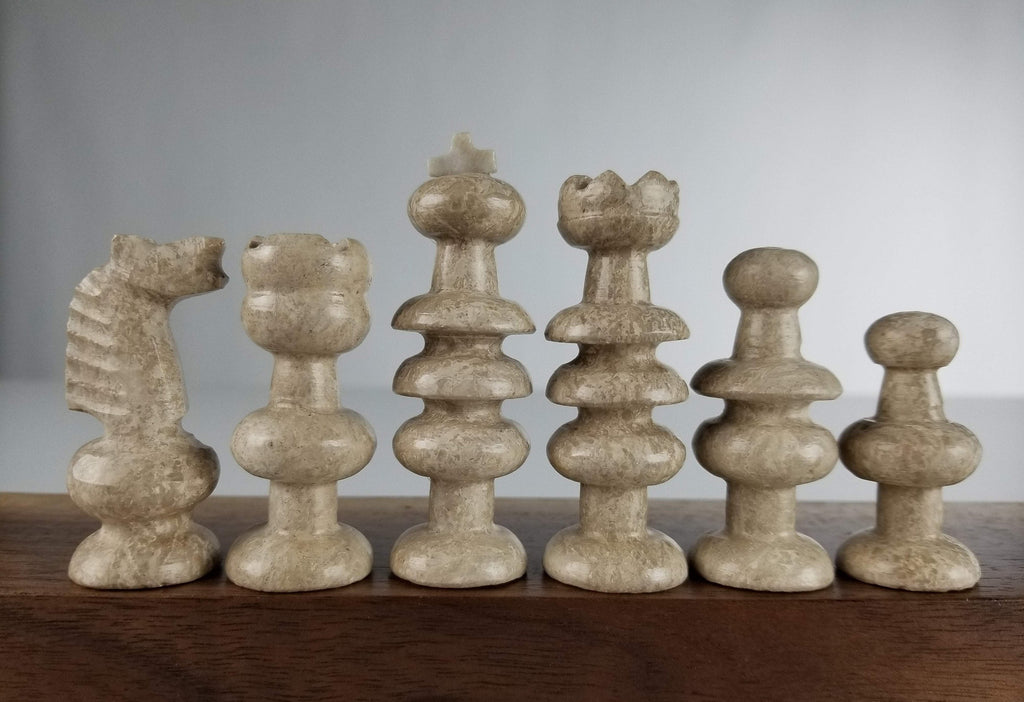 One statue of chess king + queen + rook + bishop +