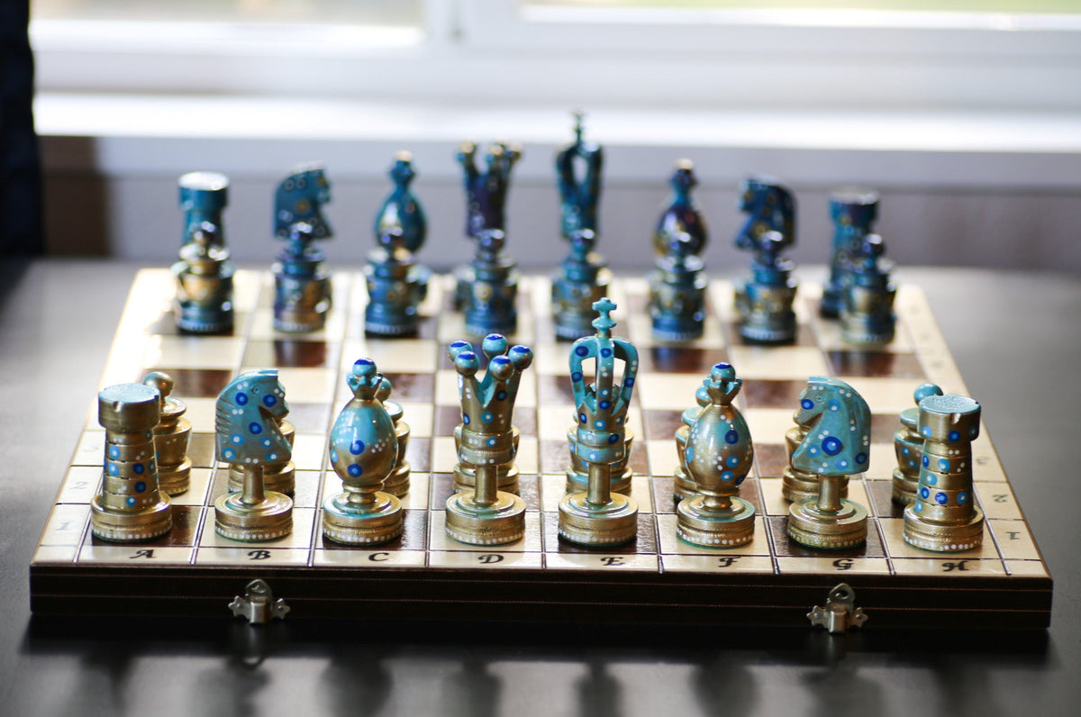 The Steady Riser, a hand-painted chess set by artist Sydney Gruber with large kings and an inlaid folding board