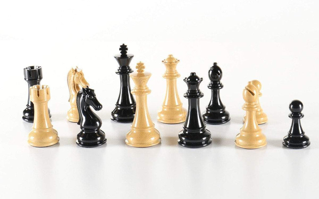 A luxurious queen chess piece black with gold crown on corner of